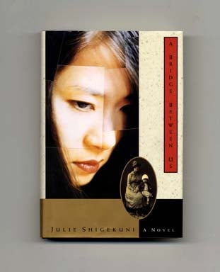 Book #18002 A Bridge Between Us - 1st Edition/1st Printing. Julie Shigekuni.